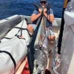 Fishing captain with a big blue fin tuna